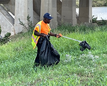 Trash pickup under a bridge form 2022 flooding.