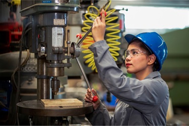 Youth working on drill-press