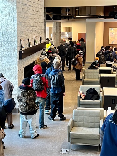 Housing and income fair participants receiving information and resources