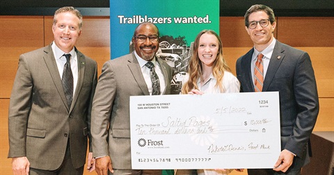 a group shot with a giant check