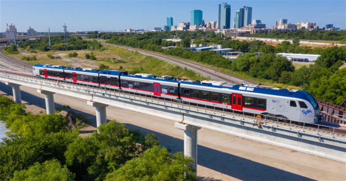 TEXRail riding on its tracks