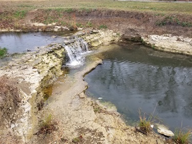 Waterfall over limestone bedrock after recent rains