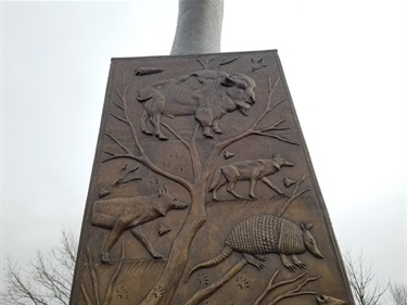 Prairie Wind sculpture by artist Michael Pavlosvky harkens to the prairie roots of North Texas. Native prairie mammals and evidence of paleo-people's history on the North Texas prairies.