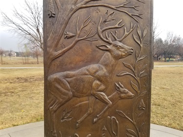 Prairie Wind sculpture by artist Michael Pavlosvky harkens to the prairie roots of North Texas. Native prairie mammals and evidence of paleo-people's history on the North Texas prairies.