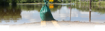 Sandbag to prevent travel into flooded area