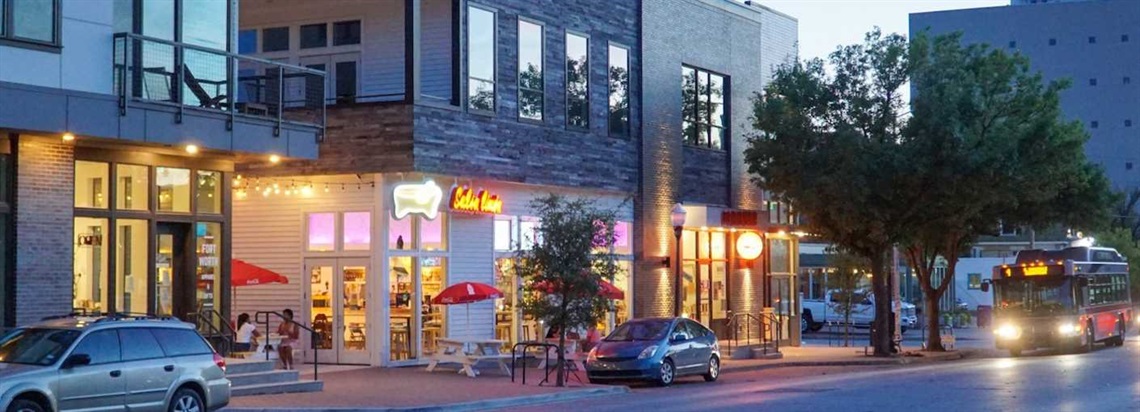 Photo of businesses and a street scene in Magnolia Urban Village