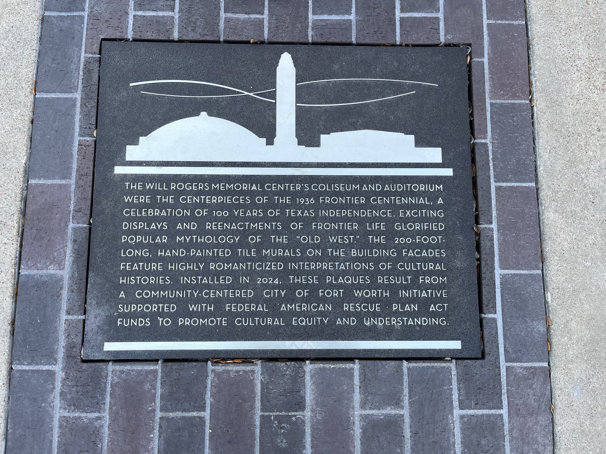 Plaque describing the history of the Will Rogers Memorial Center and its 1936 Frontier Centennial murals, installed in 2024 as part of a Fort Worth cultural initiative.
