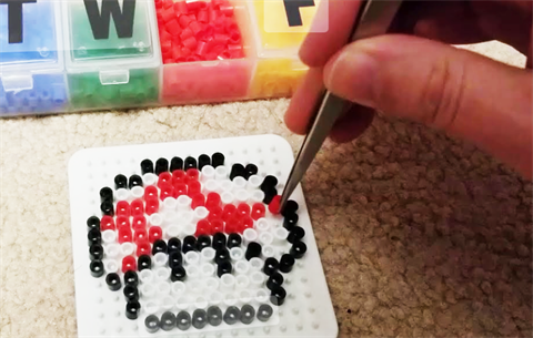 simplistic video game image created with perler beads
