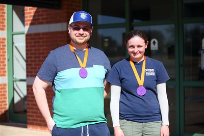 Second place finishers in the Adult Spelling Bee wearing medals