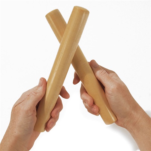 hands holding a pair of wooden clapping sticks