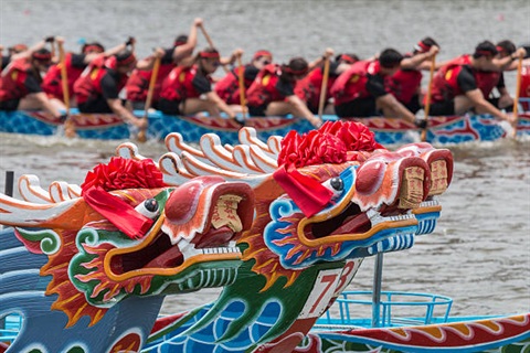 dragon boats in the water