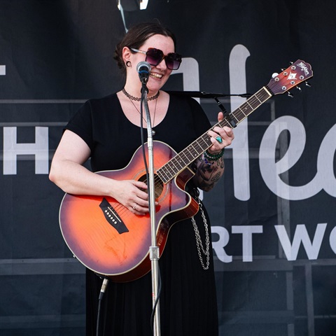Amplify 817 / Fort Worth local artist Gabby Minton with her guitar