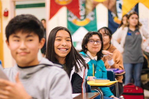 A group of teenagers in a classroom