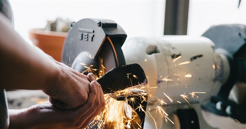 grinding tool being used on metal