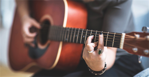 Woman playing the guitar