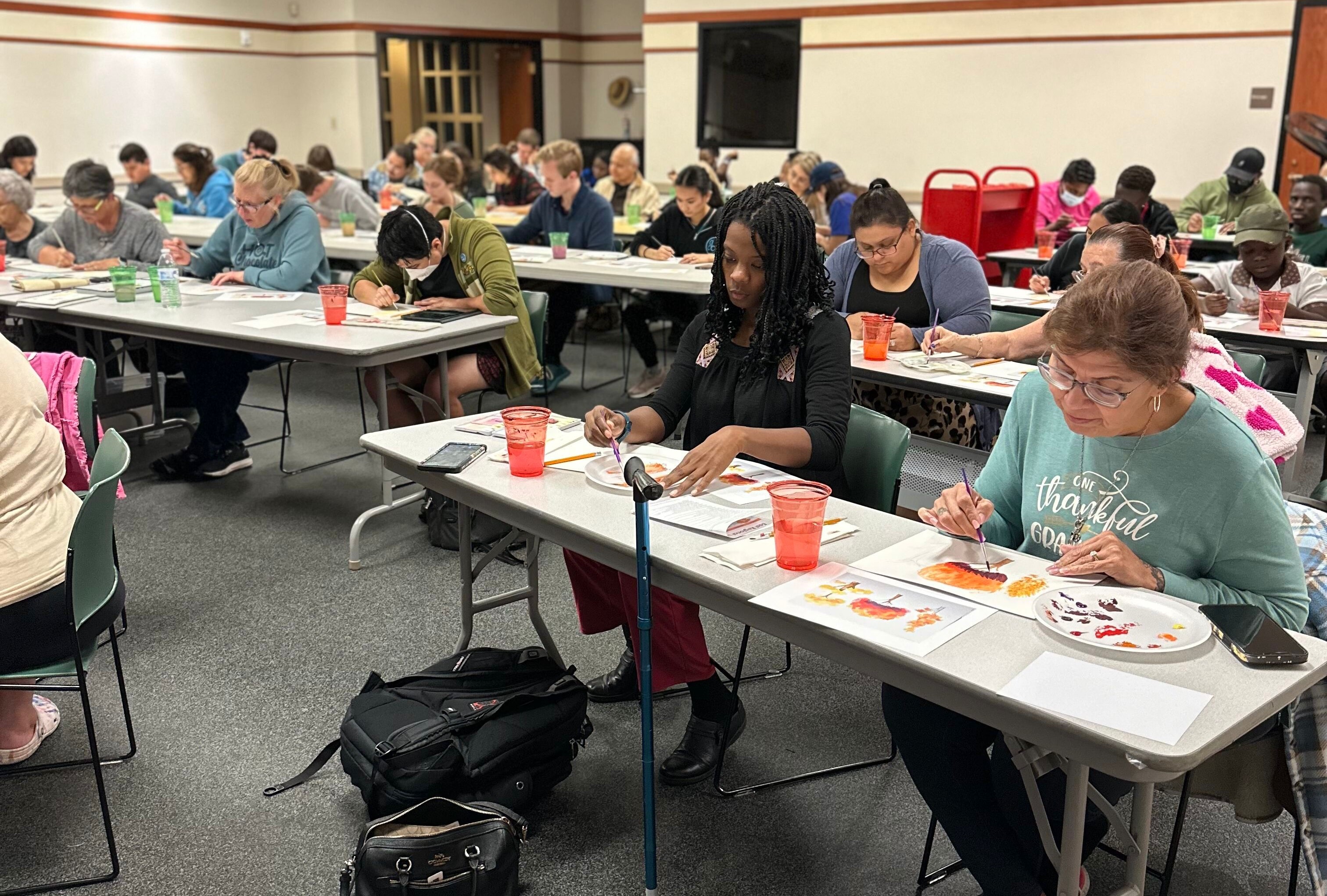 a photo of participants at the east regional library painting club