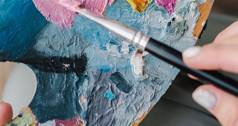 a hand painting on canvas using oils