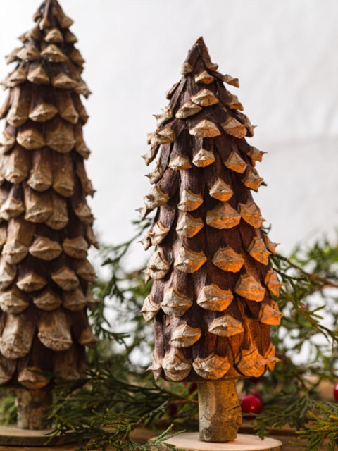 a little tree decoration made out of a pine cone