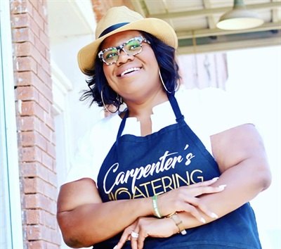 portrait of katrina carpenter outside her restaurant