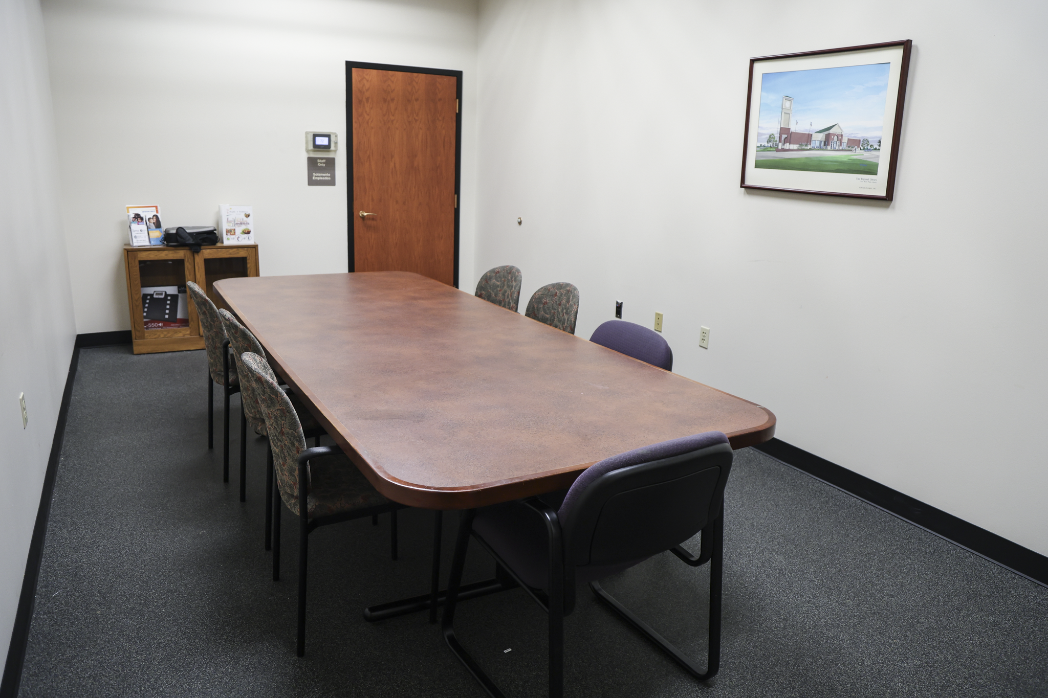 Rental room featuring a table with seven chairs.