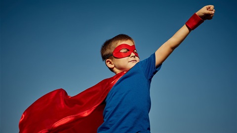 boy dressed as a superhero