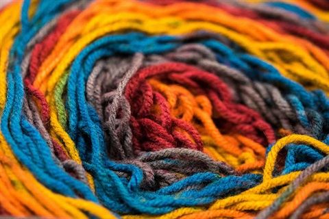 A circular rainbow of colorful yarn