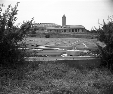 Framework of Casa Mañana with Pioneer Palace in the background, July 10, 1956. (Photo: Fort Worth Star-Telegram Collection, University of Texas at Arlington Libraries)