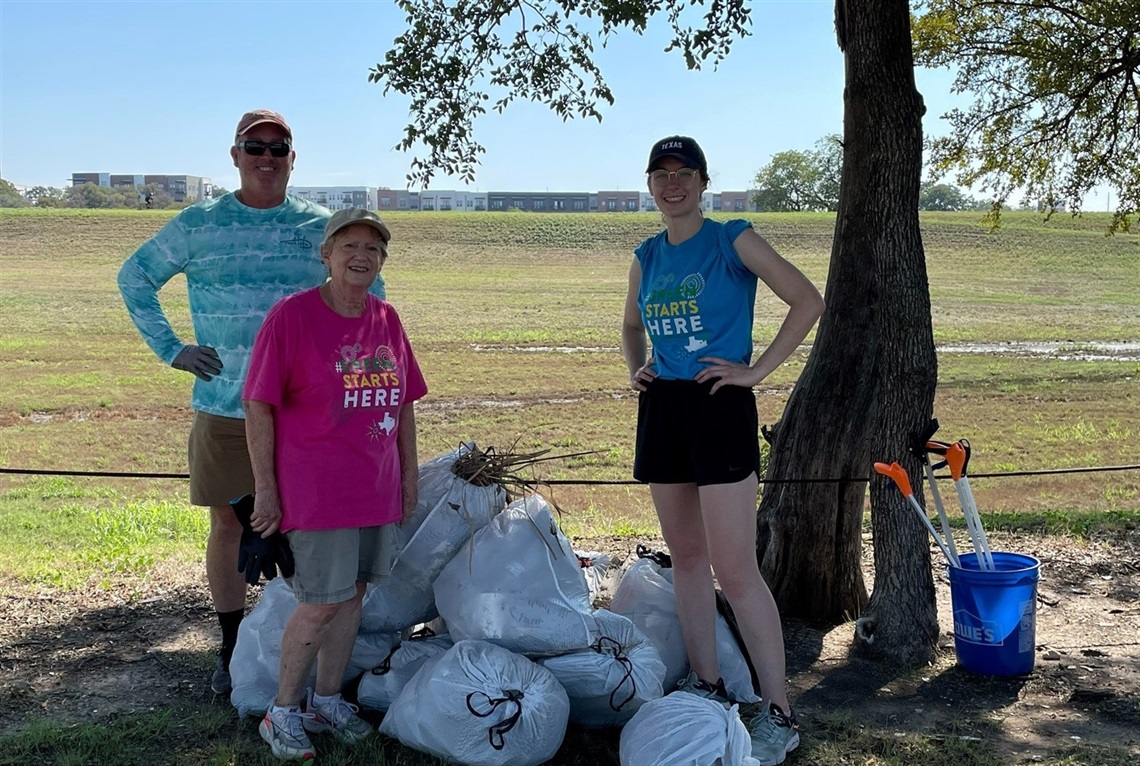 CITY NEWS flood-litter pickup-kfwb board members.jpg