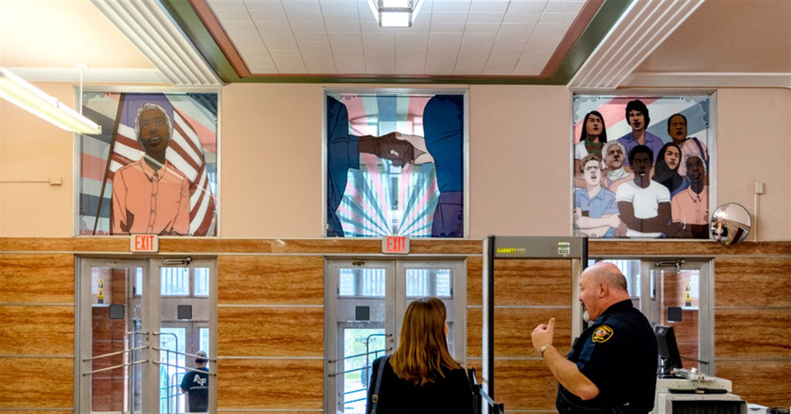 photo of art pieces in the wall above entrance doors