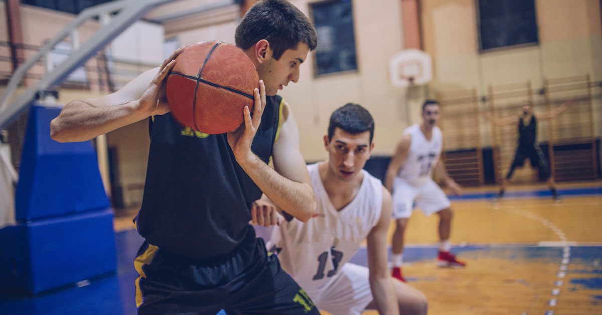 Men playing basketball