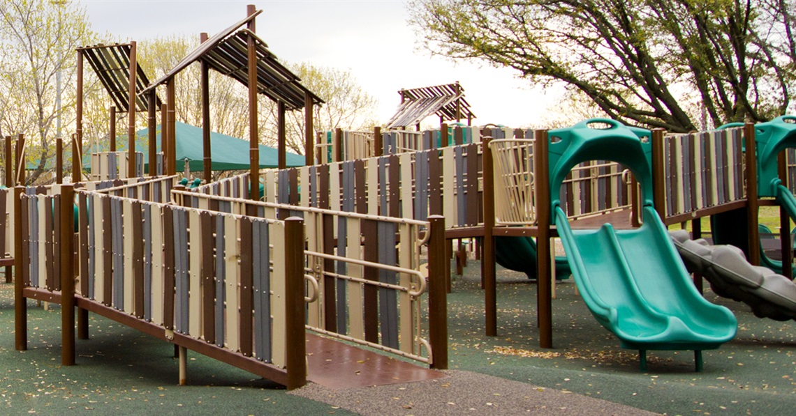 Inclusive play gym with slides at Patricia LeBlanc park