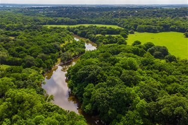 Aerial photo of Bear Creek and the trees and land around it