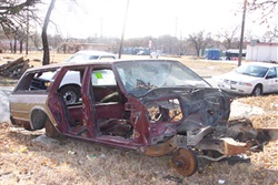 Abandoned junk vehicle on property