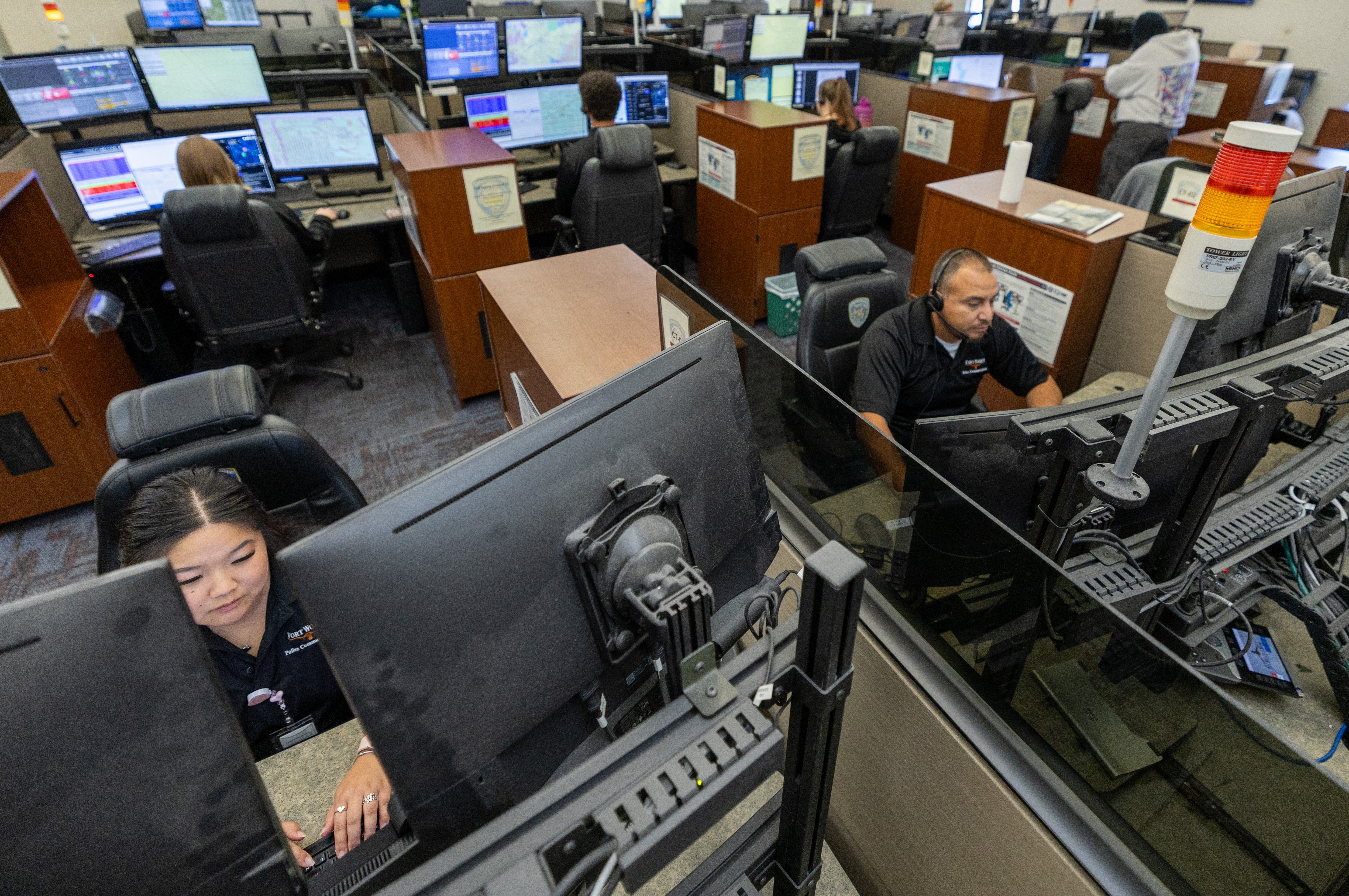 911 call responders working side by side in an office space