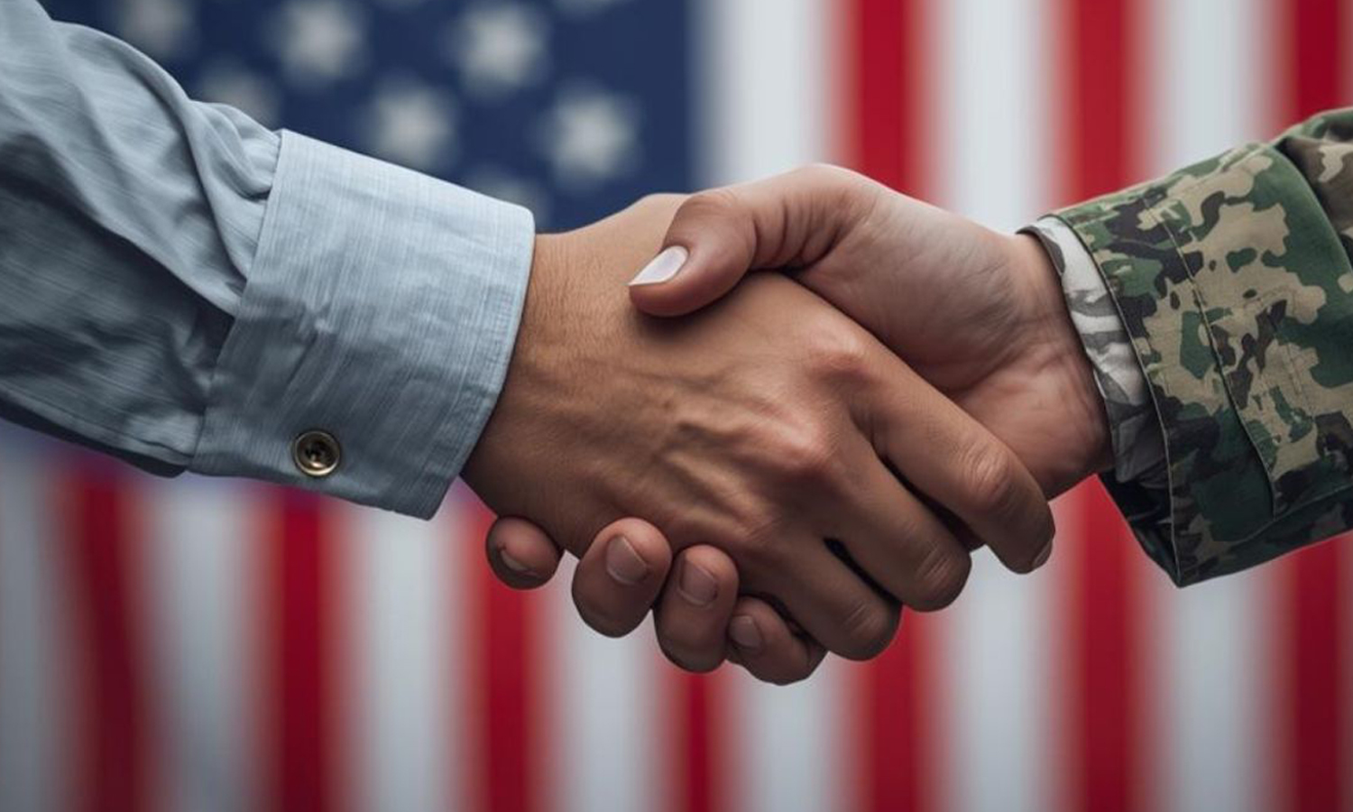 A close-up photo of a handshake between a man in a business shirt and a man in a military uniform, with the American flag as a background