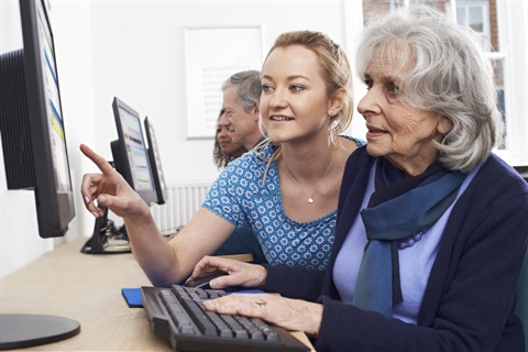 Woman assisted on computer