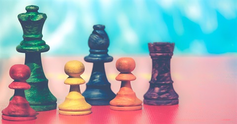 Colorful photo of various different chess pieces