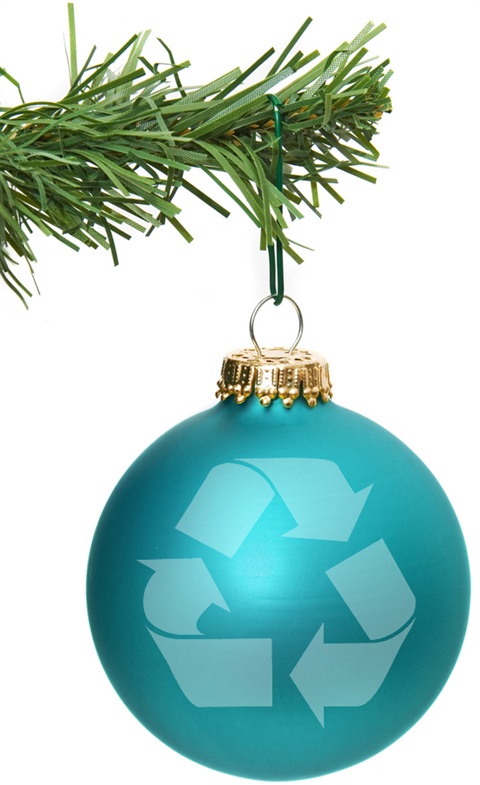 A Christmas ornament with a recycling logo on it