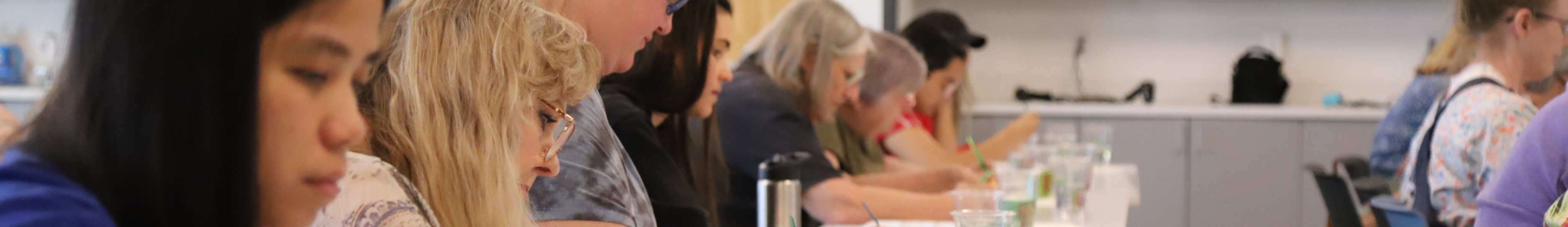 A photo of multiple adults engaging in a Fort Worth Public Library program.