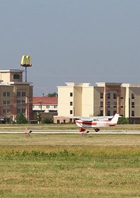 A plane taking off from the runway at Spinks Airport